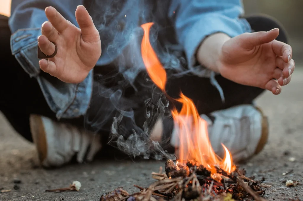 hands-near-bonfire-2022-10-26-05-19-39-utc